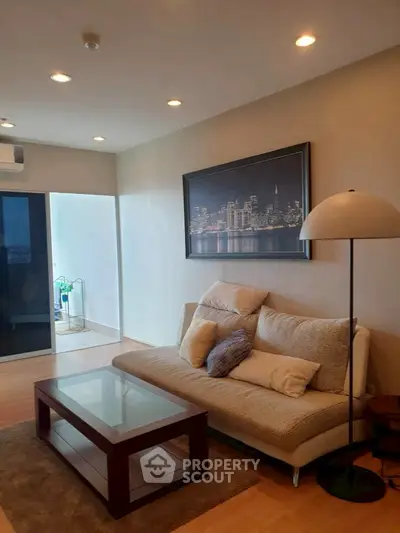 Cozy living room with modern decor and cityscape artwork