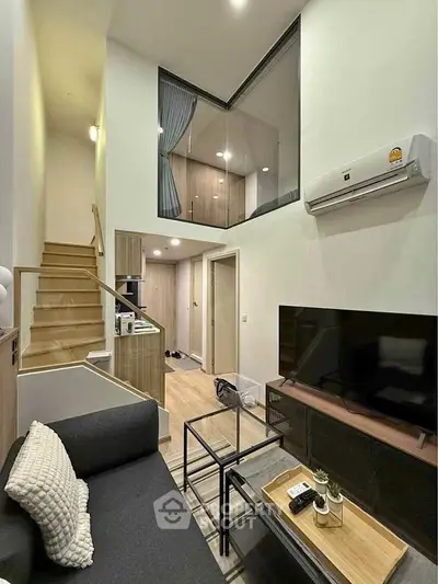 Modern duplex apartment with stylish living room and open kitchen layout