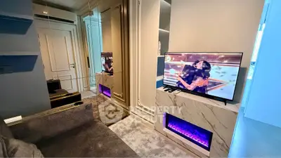 Luxurious living room with modern TV setup and elegant decor