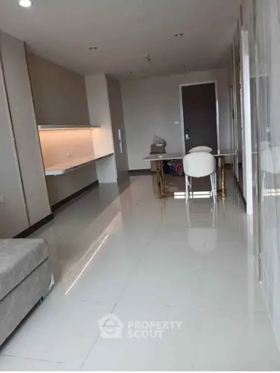 Modern living room with sleek design and elegant furniture in a contemporary apartment.