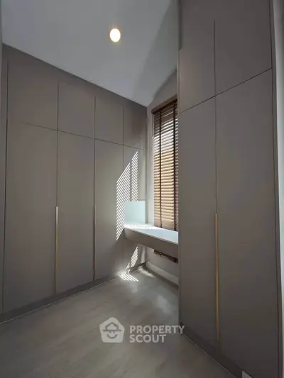 Spacious modern storage room with sleek cabinetry and natural light