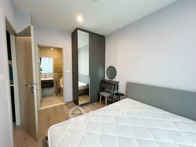 Modern bedroom with ensuite bathroom and stylish furniture