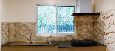 Modern kitchen with marble backsplash and gas stove