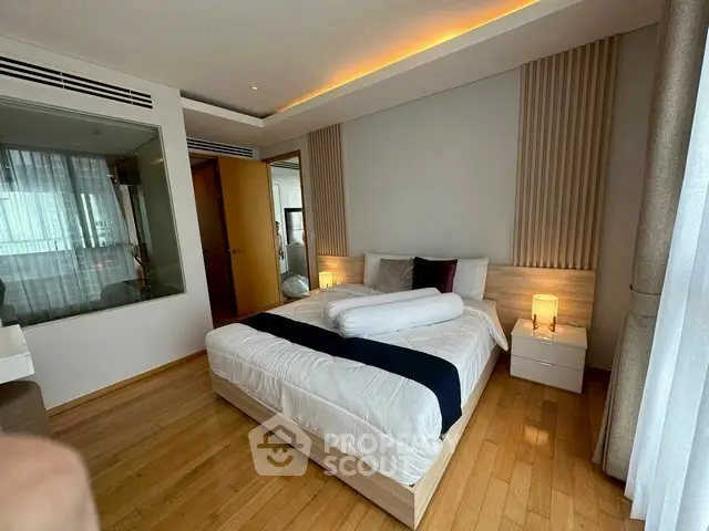 Luxurious modern bedroom with elegant lighting and wooden flooring