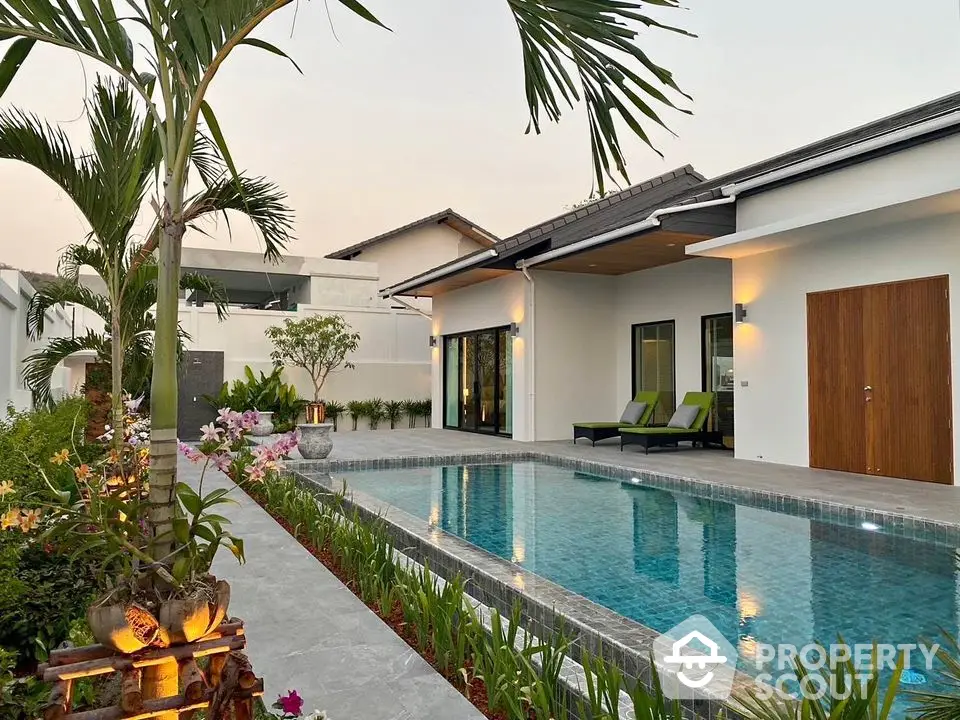 Luxurious modern villa with private pool and lush garden, perfect for serene living.