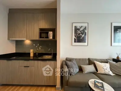 Modern open-layout kitchen and cozy living room with stylish decor