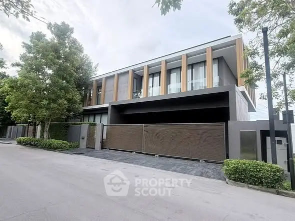 Luxurious modern house exterior with sleek design and lush greenery, perfect for upscale living.