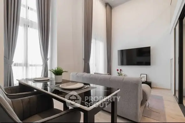 Modern living room with high ceilings and elegant decor