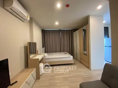 Modern bedroom with air conditioning and stylish furniture in a cozy apartment.