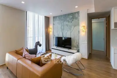Modern living room with stylish decor and large window, featuring a cozy sofa and flat-screen TV.