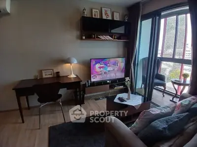 Cozy living room with modern decor and balcony view
