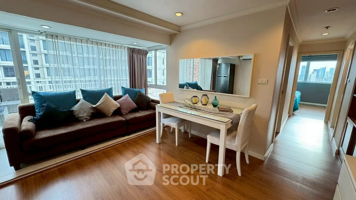 Spacious living room with elegant decor and city view, perfect for urban living.
