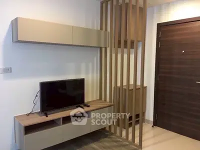 Modern living room with sleek TV stand and wooden accents, perfect for contemporary urban living.