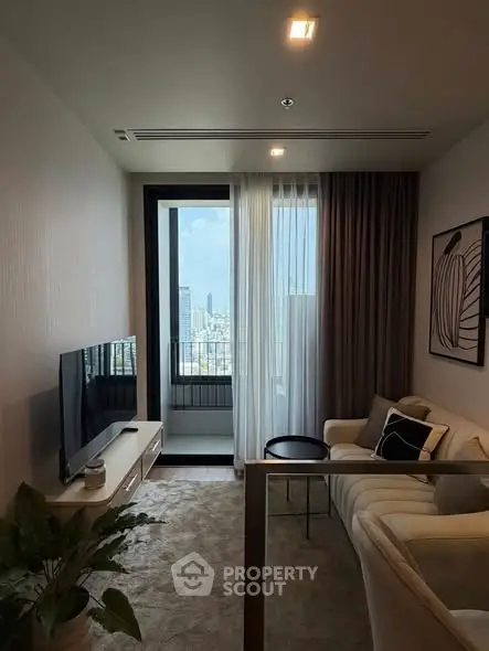 Stylish modern living room with city view, cozy seating, and elegant decor.