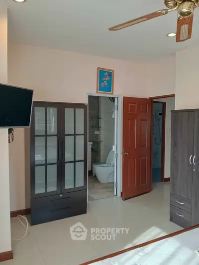 Spacious bedroom with modern furniture and ensuite bathroom