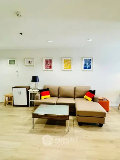 Modern living room with stylish sofa and colorful wall art