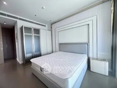 Spacious modern bedroom with sleek design and ample natural light