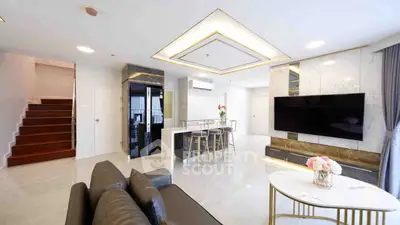 Luxurious modern living room with open kitchen and elegant decor