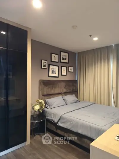 Modern bedroom with stylish decor and cozy ambiance in a contemporary apartment.