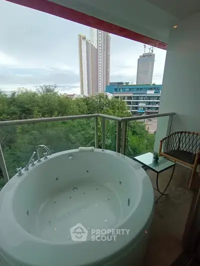 Luxurious balcony with private jacuzzi and stunning city view
