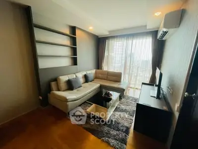 Modern living room with city view, featuring sleek furniture and stylish decor.