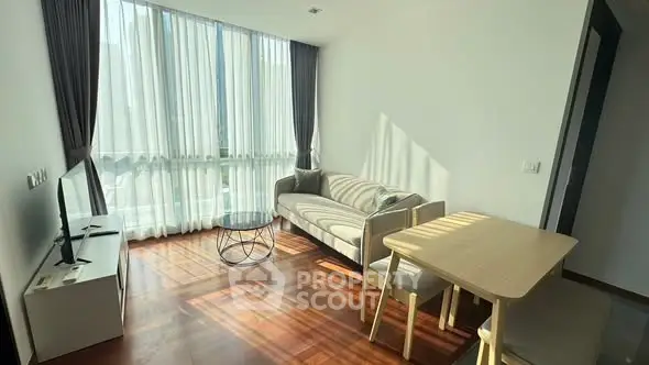 Bright modern living room with large windows and stylish furniture