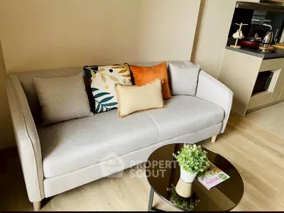 Modern living room with stylish sofa and cozy decor in a contemporary apartment.