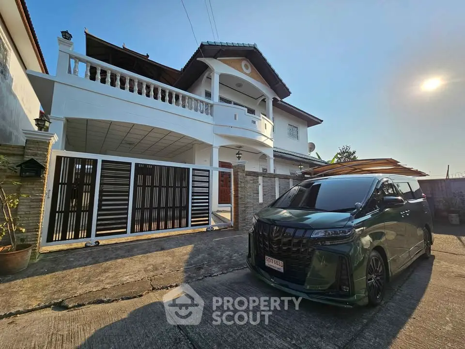 Stunning two-story house with modern design and spacious driveway, perfect for family living.