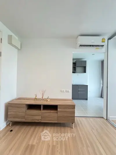 Modern apartment interior with wooden flooring and air conditioning