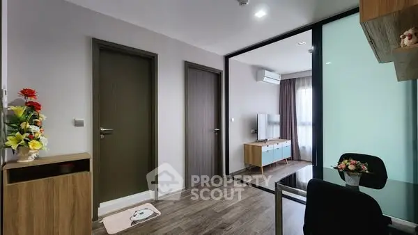 Modern living room with stylish decor and glass partition