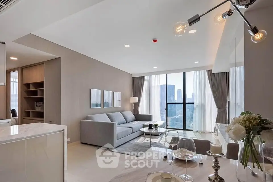 Modern living room with city view, elegant decor, and open layout in luxury apartment.
