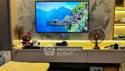 Modern living room with wall-mounted TV and stylish decor