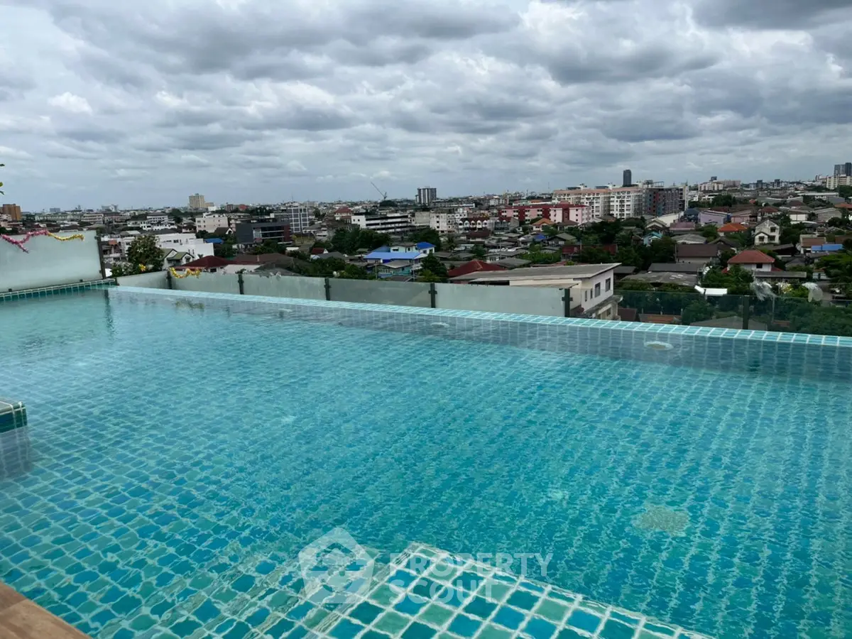Stunning rooftop infinity pool with panoramic city views, perfect for luxury living.