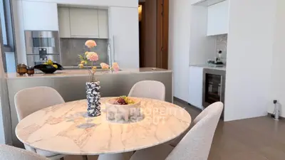 Modern kitchen with elegant dining area and marble table
