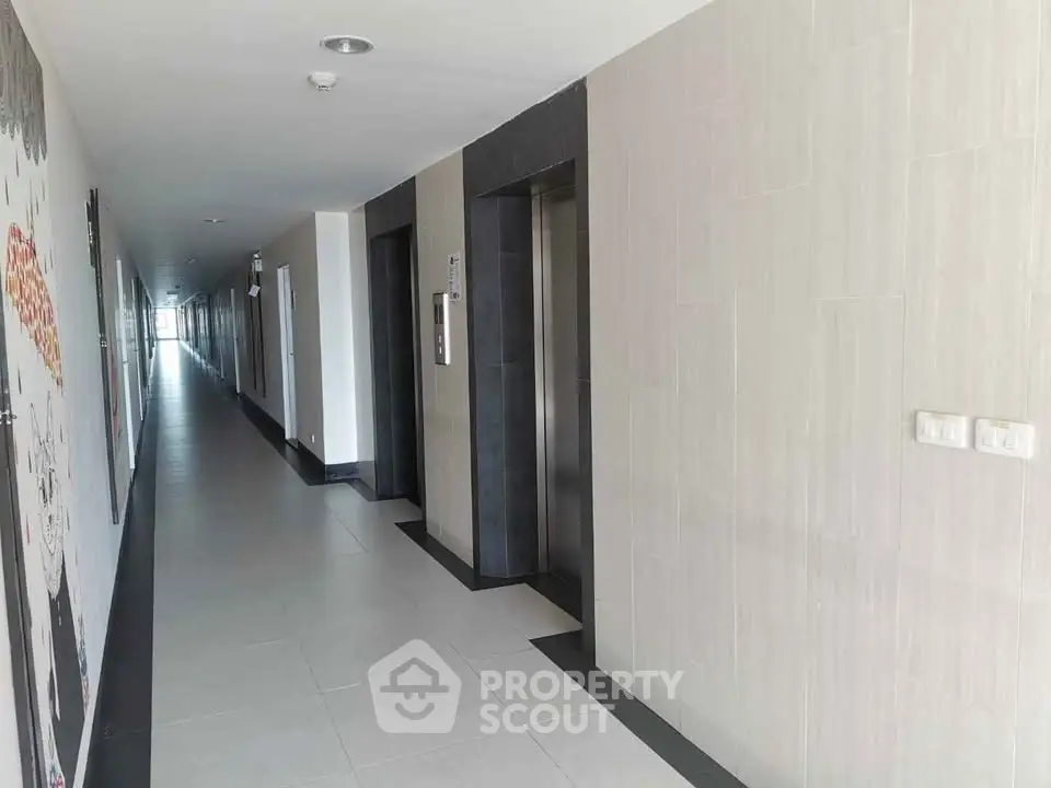 Modern apartment hallway with elevators and sleek design