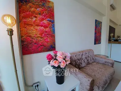 Chic living room with vibrant art and plush sofa in modern apartment