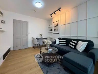Modern living room with stylish decor and cozy seating area, perfect for relaxation and entertaining.