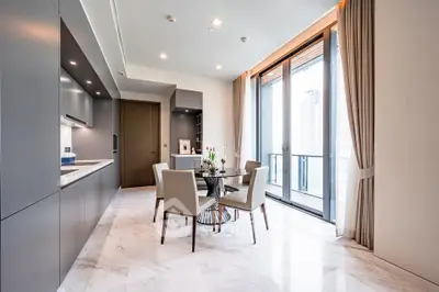 Modern kitchen with open layout and elegant dining area in luxury apartment