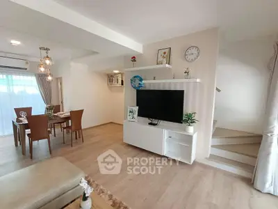 Modern living room with dining area, stylish decor, and open layout