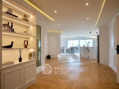 Luxurious open-plan living room with elegant decor and stunning wooden flooring
