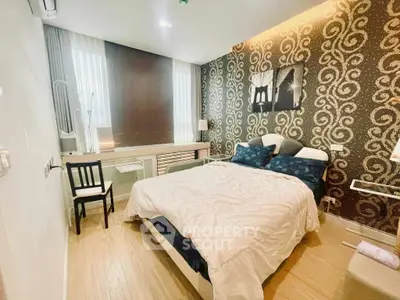 Luxurious bedroom with elegant wallpaper and modern furnishings