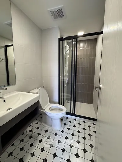Modern bathroom with sleek shower and stylish tile flooring