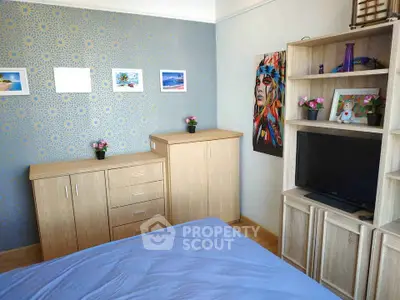 Charming bedroom with modern decor and ample storage space