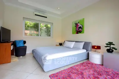 Spacious bedroom with modern decor and large window view