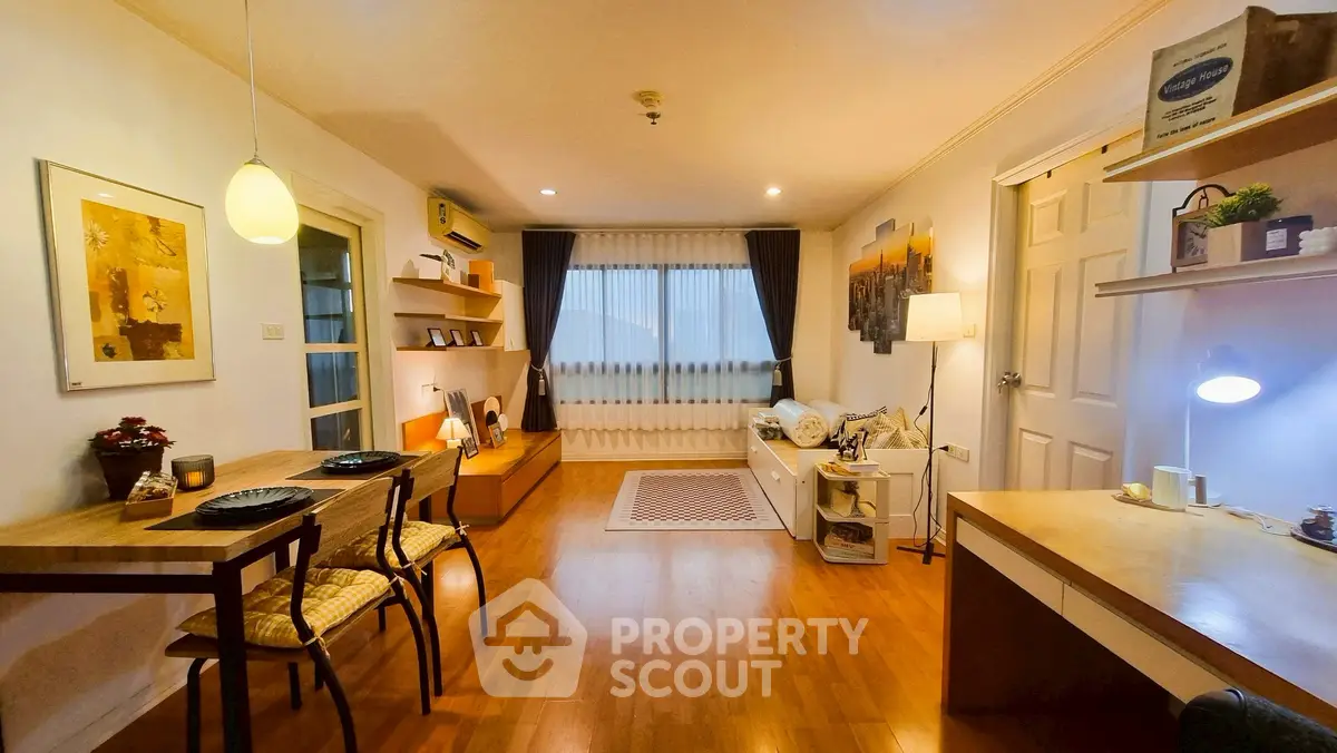 Charming living room with warm lighting, wooden flooring, and modern decor.