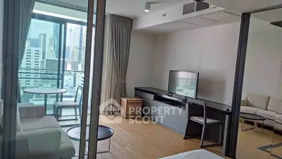 Modern living room with balcony view in high-rise apartment