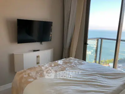 Luxurious bedroom with stunning ocean view and modern decor