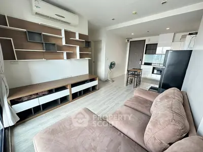 Modern living room with stylish shelving and cozy sofa in a bright apartment.