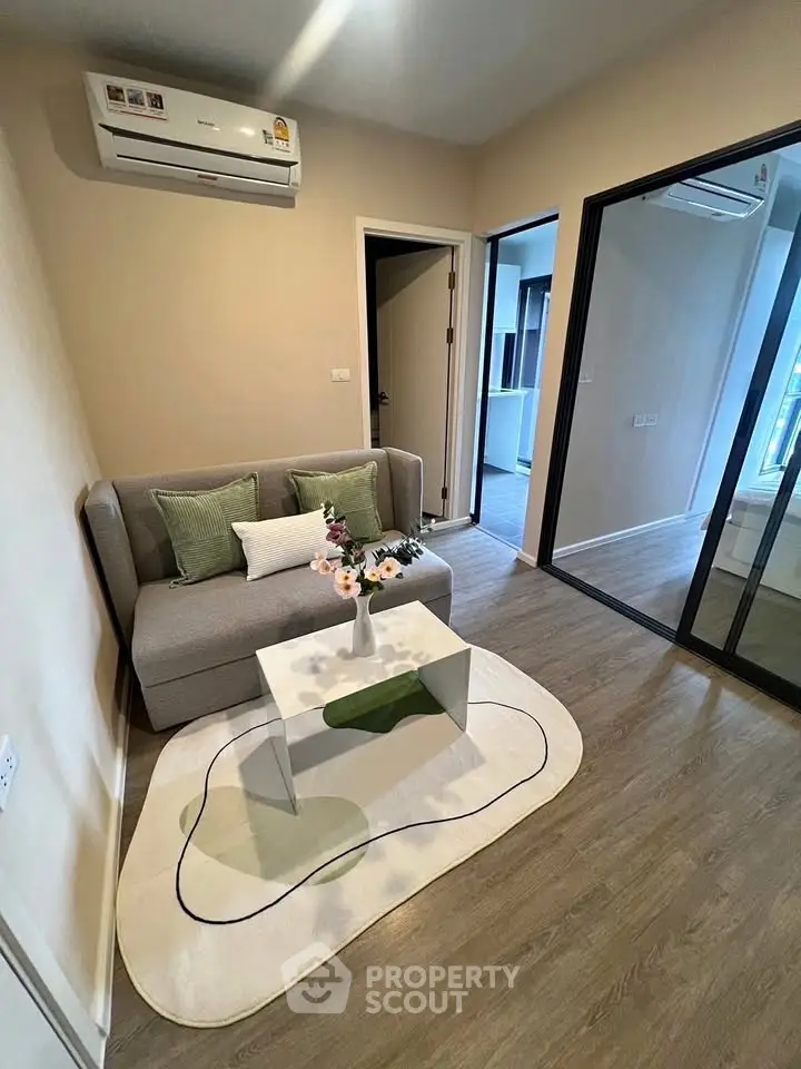 Modern living room with stylish decor and air conditioning