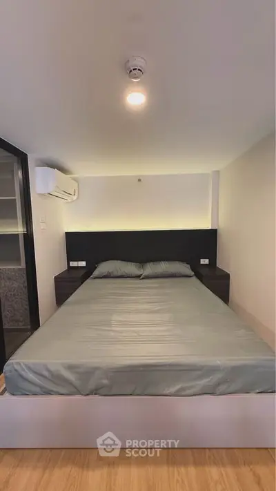 Modern bedroom with sleek design and ambient lighting